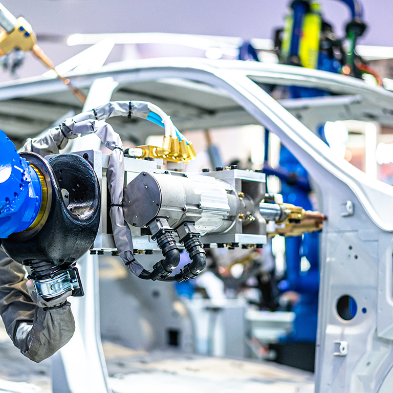 Robot arm working in car factory assembly line