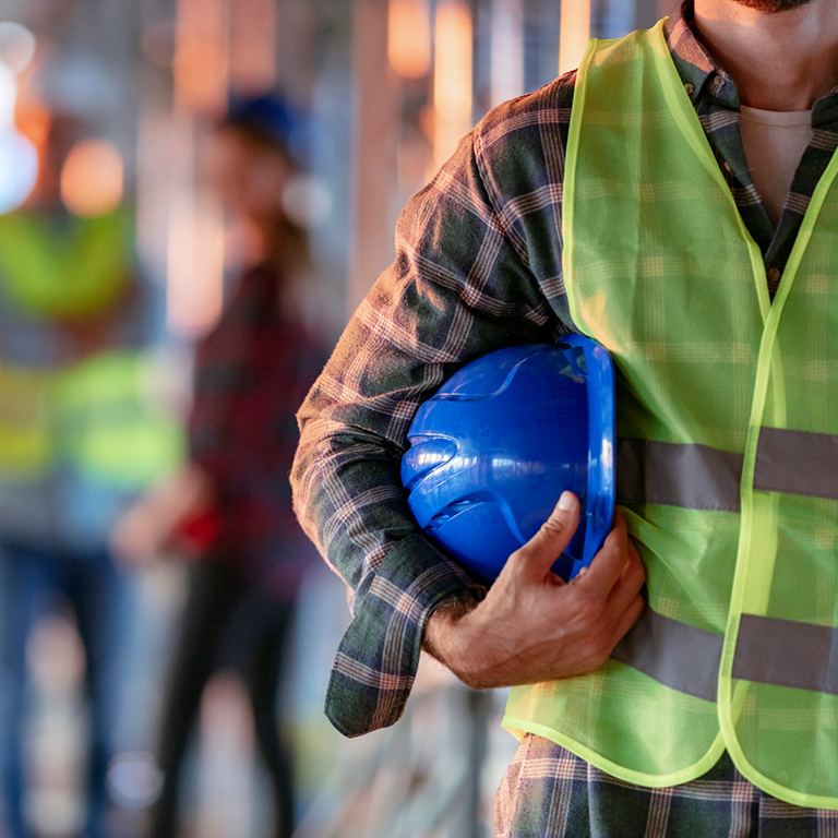 Construction worker with safety gear.