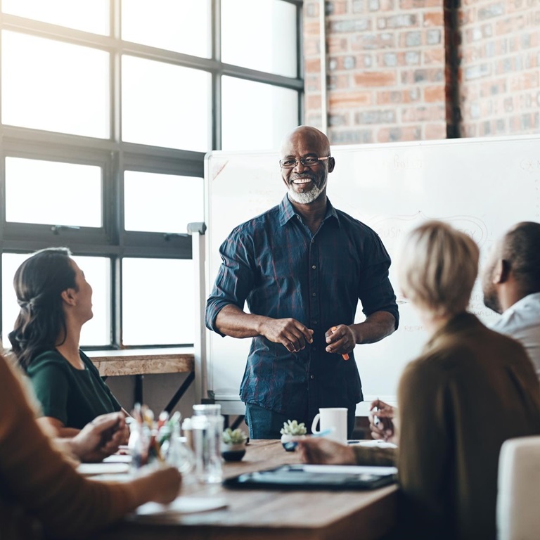 Shot of a businessman giving a presentation to his colleagues in a boardroom.