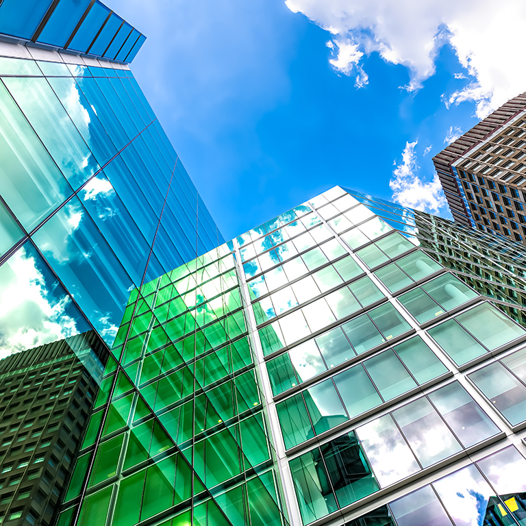 London, UK looking up on blue sky cityscape skyline exterior of office financial bank buildings in center of city in Victoria Westminster with modern glass architecture nobody low angle view