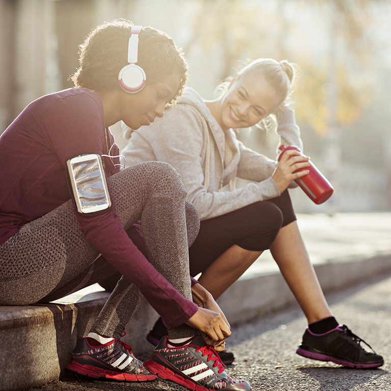 Close up of a young women getting ready for a morning run