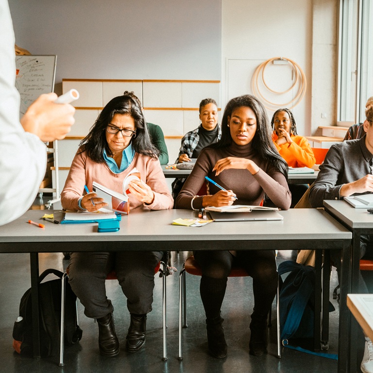 Students listen and take notes