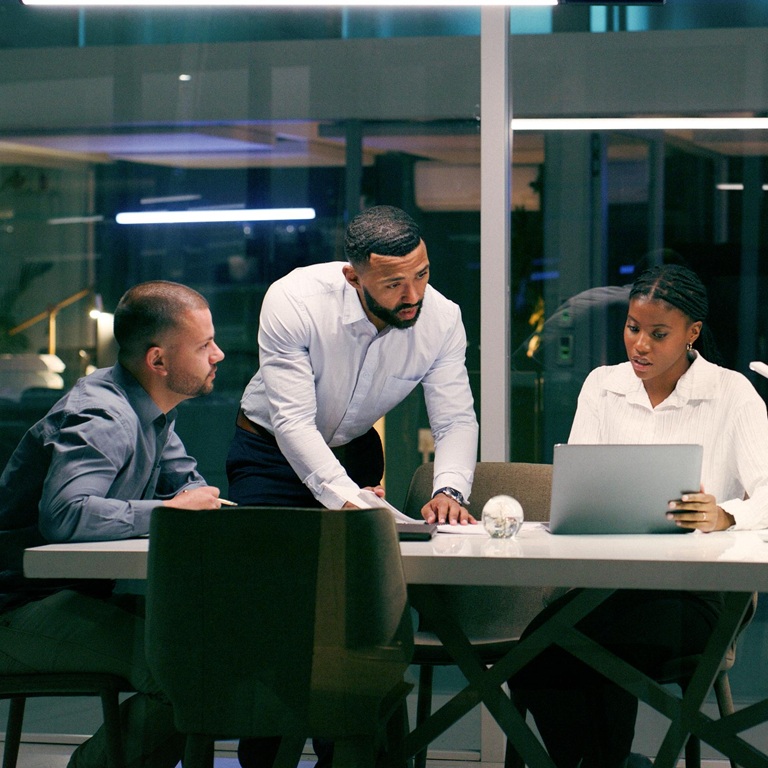 Team discusses project in modern office