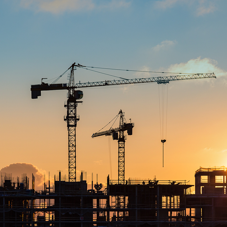 tower cranes build high rise residential building