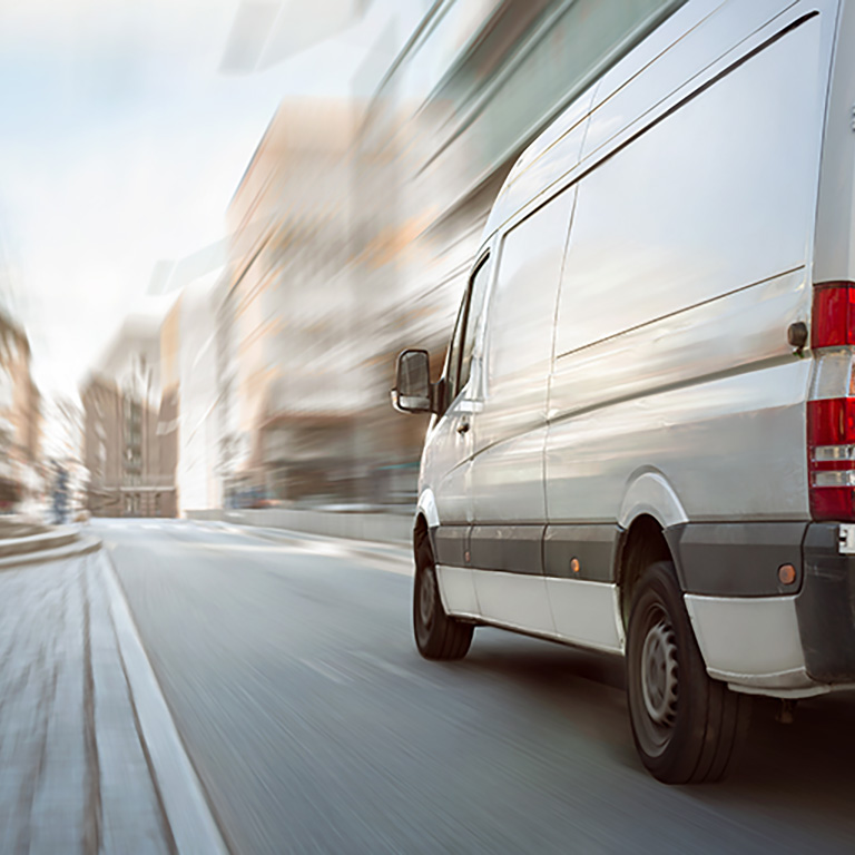 Transporter driving down road