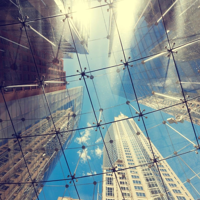 View of skyscrapers from the glass ceiling