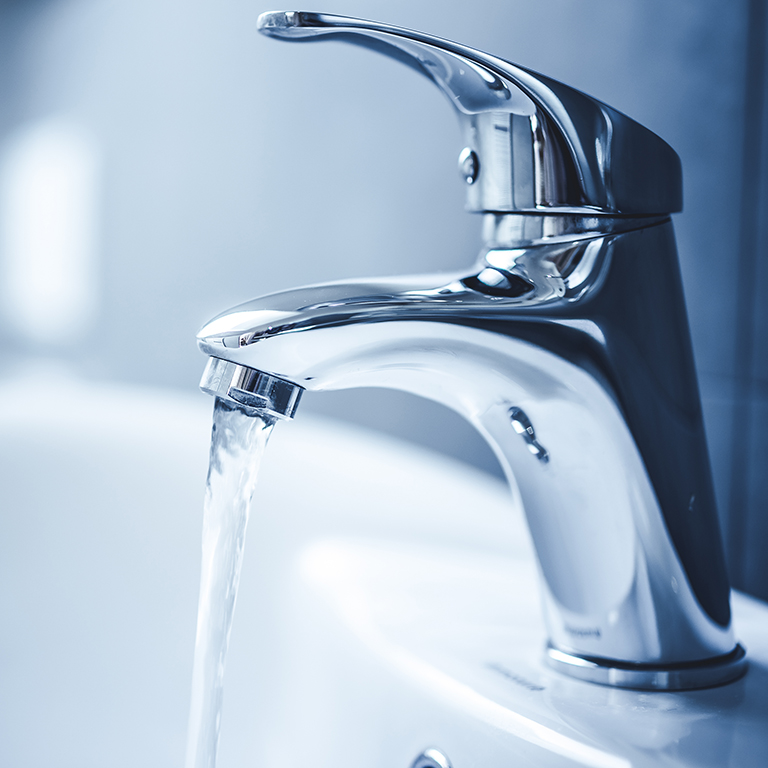 Water tap , faucet. Flow water in bathroom with sink. Modern clean house. Backround hygiene.