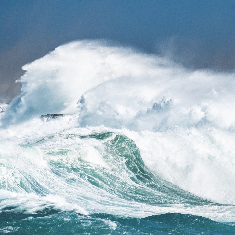 Waves crash against rocks at the shore
