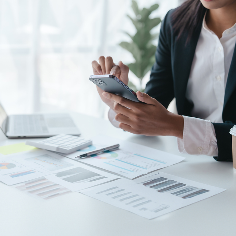 Woman at work browsing on phone