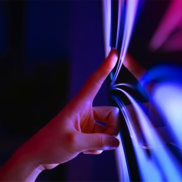 Woman's hand touches the screen with the lines