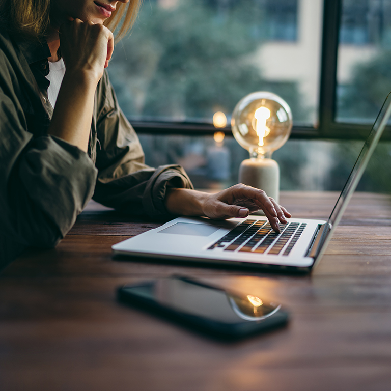 Young woman working with a laptop. 