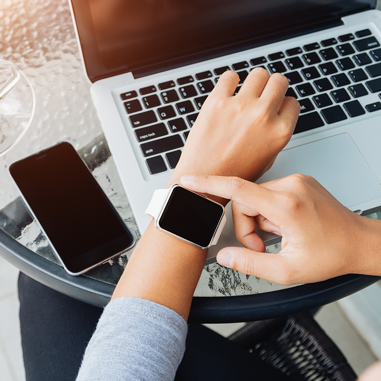 woman using smart watch in coffee shop, modern city lifestyle