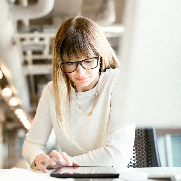 Woman working with tablet in modern office space