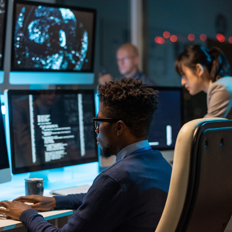 Workers looking at different screens