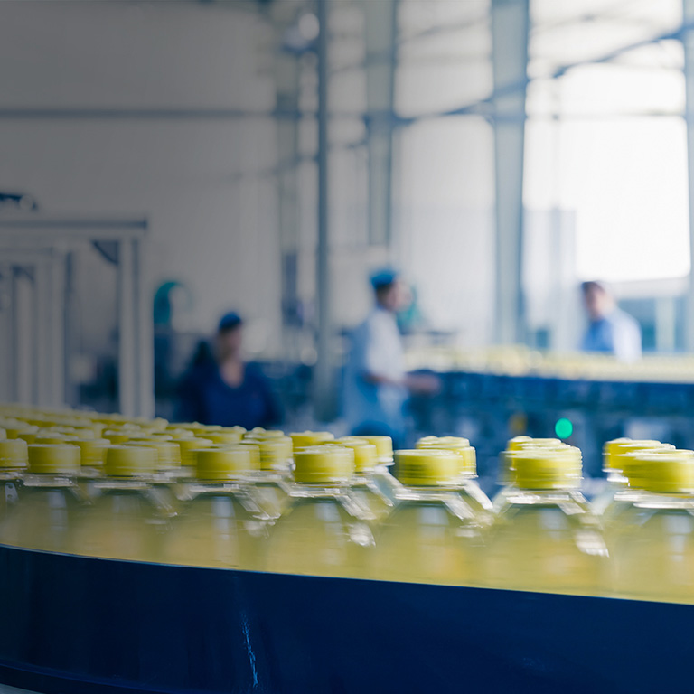 Yellow bottle on production line